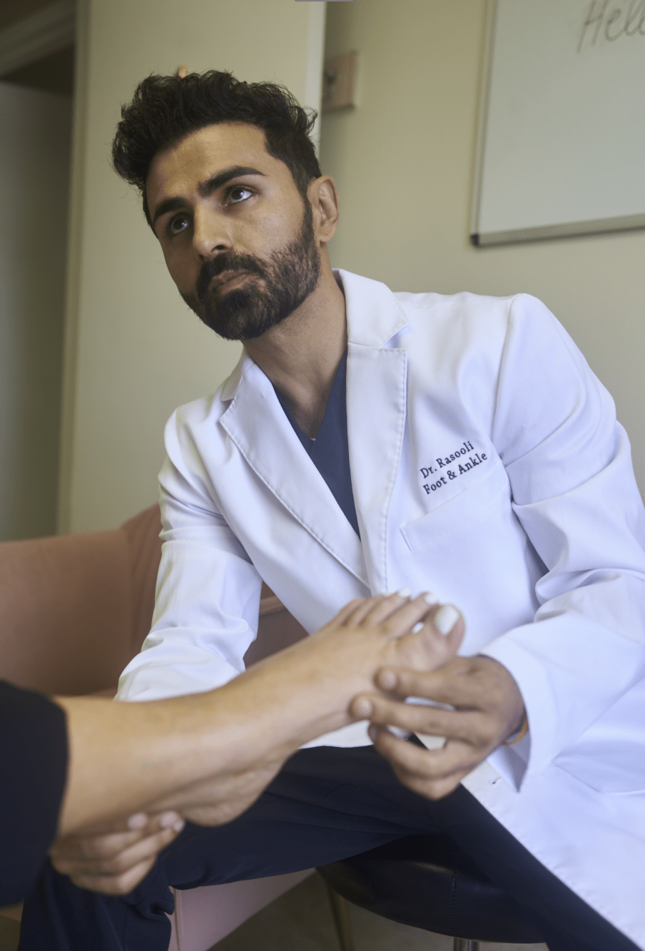Dr. Rasooli providing foot exam